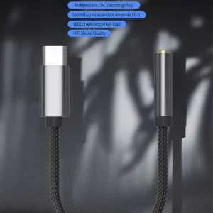 A small, black USB-C to 3.5mm audio adapter, providing high-quality sound for headphones and earphones.